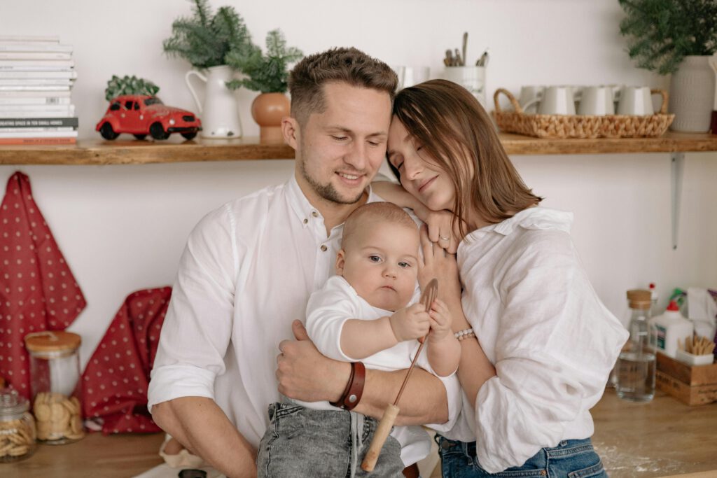 Photo of young parents with their baby boy